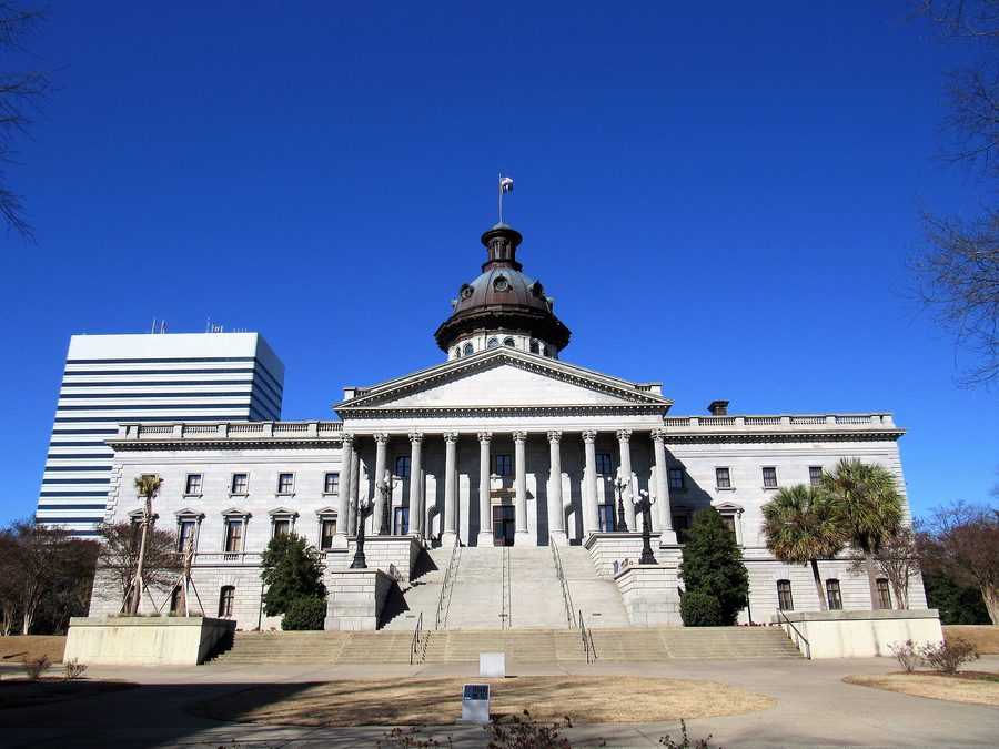 The South Carolina State House in Columbia, framed by palmetto trees